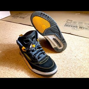 Black university gold Jordan spizikes